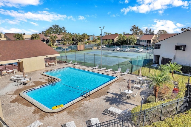 view of swimming pool with a patio