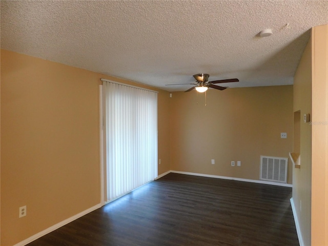 unfurnished room featuring dark hardwood / wood-style floors, ceiling fan, and a textured ceiling