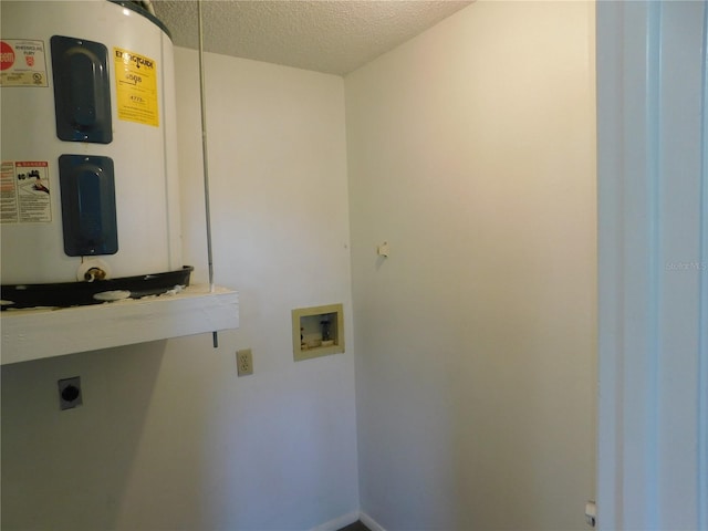 clothes washing area featuring washer hookup, electric dryer hookup, electric water heater, and a textured ceiling