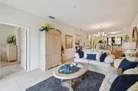 living room featuring a notable chandelier