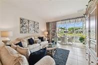 living room with tile patterned flooring