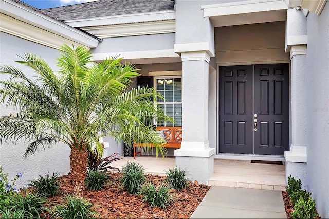 doorway to property featuring covered porch