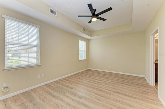 empty room featuring ceiling fan and light wood-type flooring