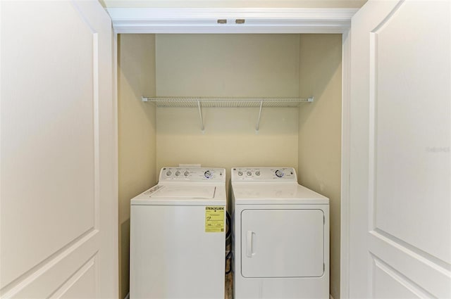 laundry room featuring separate washer and dryer