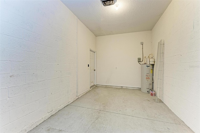 garage featuring a garage door opener and water heater