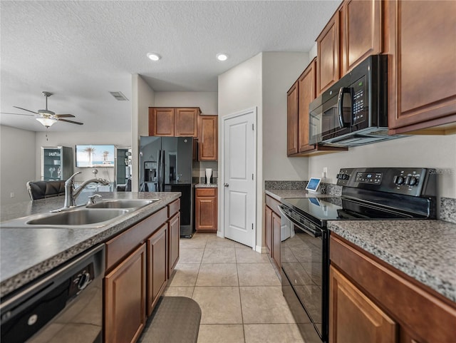 kitchen featuring ceiling fan, sink, a textured ceiling, light tile patterned floors, and black appliances