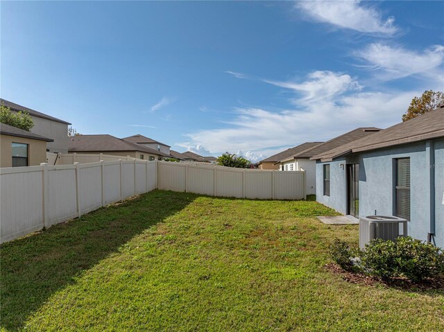 view of yard featuring central AC