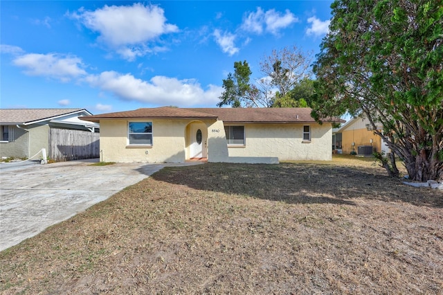 ranch-style home with central AC unit