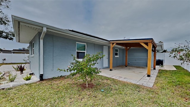 rear view of house featuring a lawn