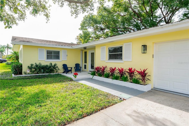 ranch-style house with a front lawn and a garage