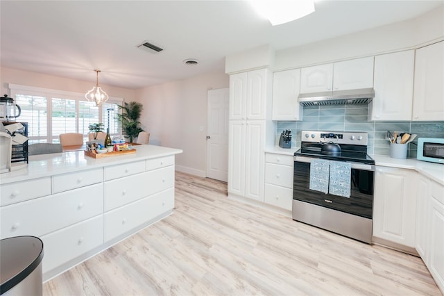 kitchen featuring white cabinets, decorative light fixtures, stainless steel range with electric cooktop, and light hardwood / wood-style flooring