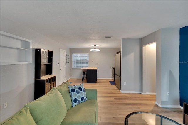 living room with light hardwood / wood-style floors