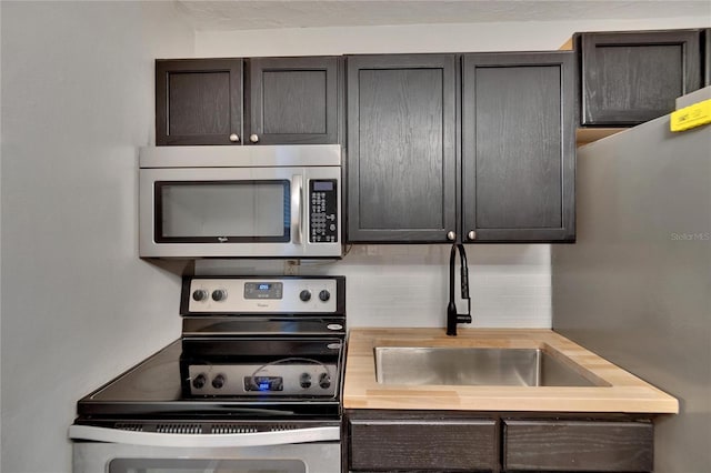 kitchen featuring backsplash, sink, and stainless steel appliances