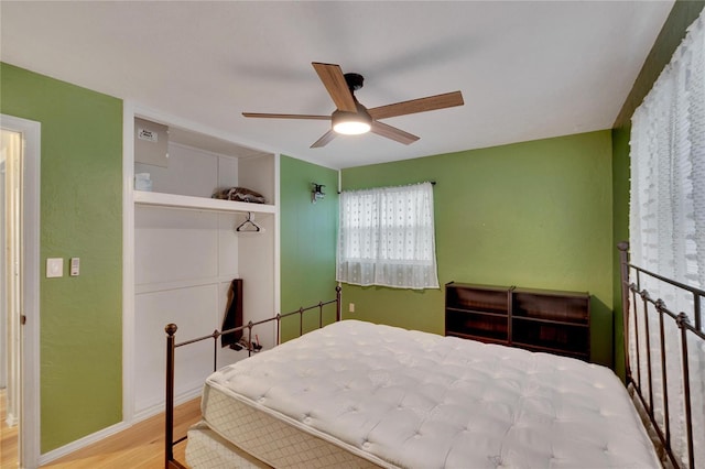 bedroom featuring ceiling fan and light hardwood / wood-style floors