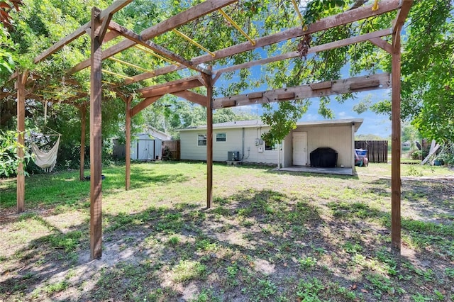 6524 14th St N, Saint Petersburg, FL 33702 - view of yard featuring cooling unit and a pergola