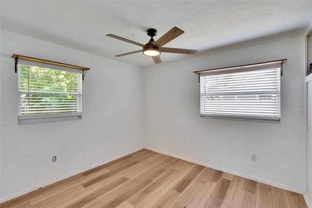 6524 14th St N, Saint Petersburg, FL 33702 - spare room with ceiling fan, light wood-type flooring, plenty of natural light, and baseboards
