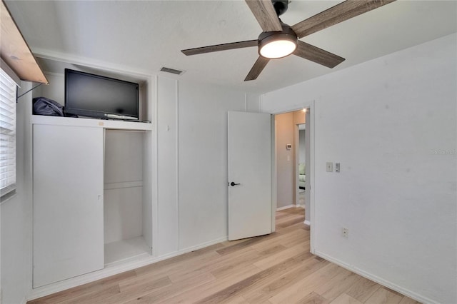 6524 14th St N, Saint Petersburg, FL 33702 - unfurnished bedroom with wood finished floors, baseboards, and a ceiling fan