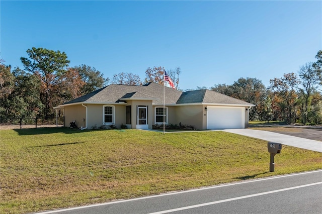 ranch-style house featuring a garage and a front yard