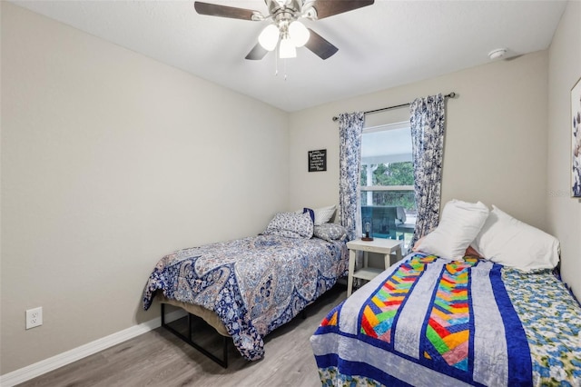 bedroom featuring hardwood / wood-style flooring and ceiling fan