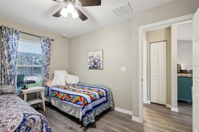 bedroom featuring hardwood / wood-style flooring and ceiling fan