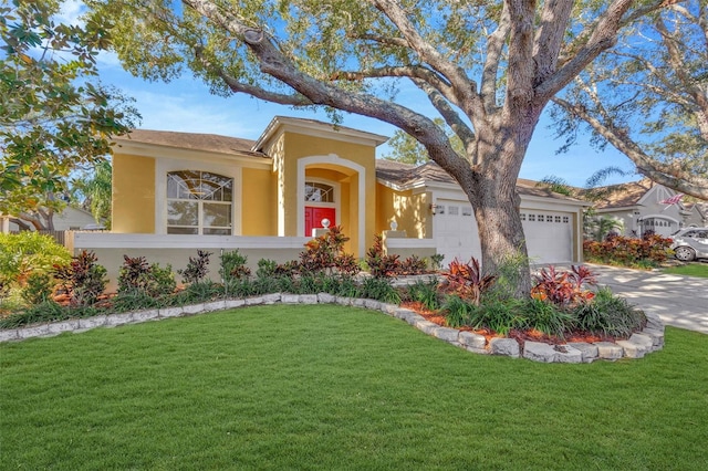 ranch-style home with a garage and a front yard