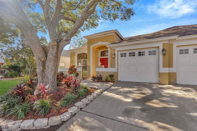 view of front of property with a garage