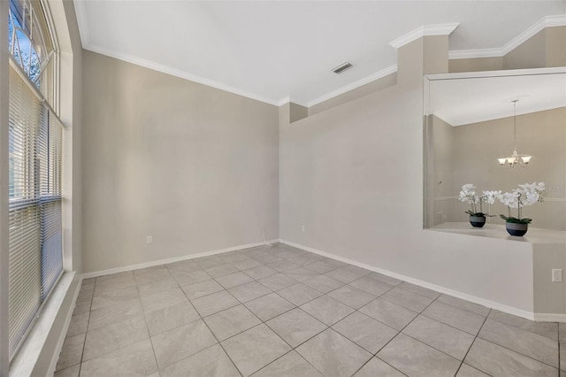 empty room with a healthy amount of sunlight, crown molding, and a chandelier