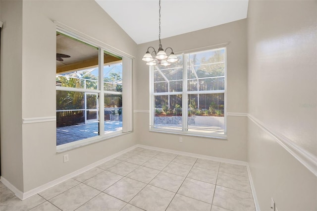 unfurnished dining area with plenty of natural light, ceiling fan with notable chandelier, and vaulted ceiling