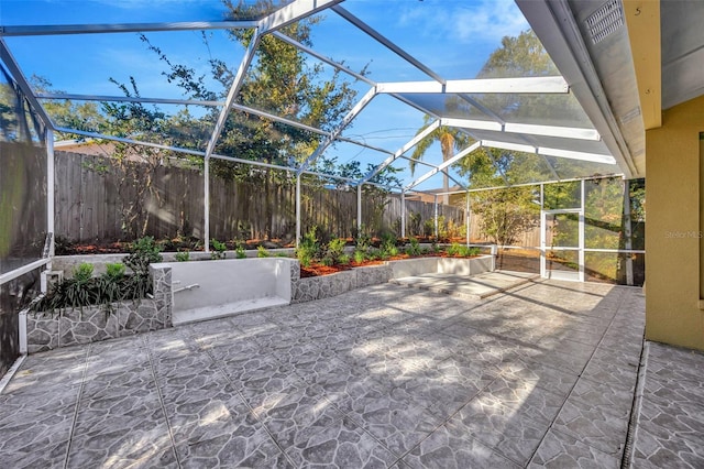 view of patio with a lanai