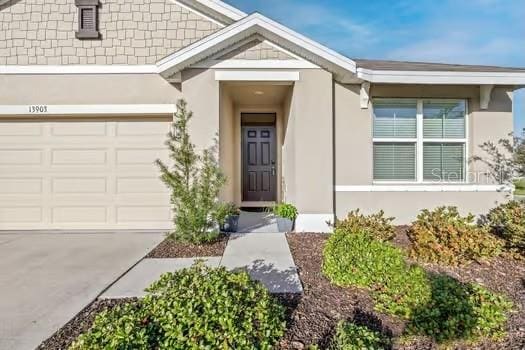 doorway to property featuring a garage