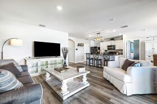 living room with dark wood-type flooring