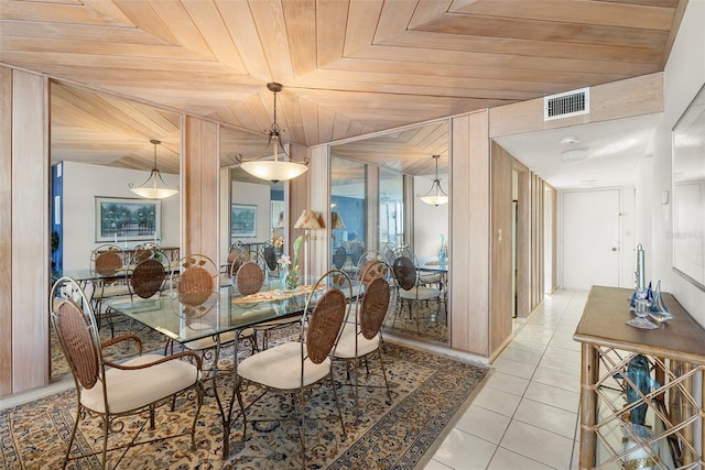 dining room with wooden ceiling and light tile patterned floors