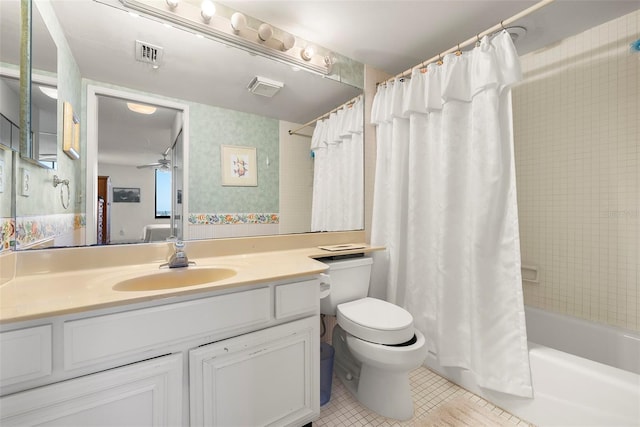 full bathroom featuring vanity, tile patterned flooring, ceiling fan, toilet, and shower / bath combo with shower curtain