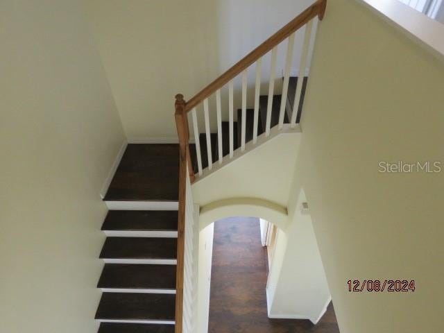 stairway with wood-type flooring