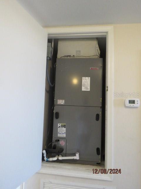 utility room featuring heating unit