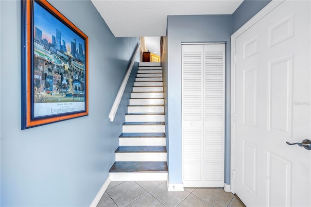 staircase with tile patterned flooring