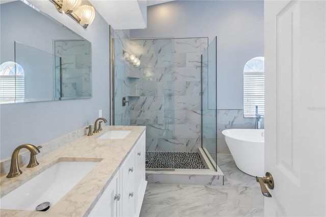 bathroom featuring separate shower and tub, vanity, and tile walls