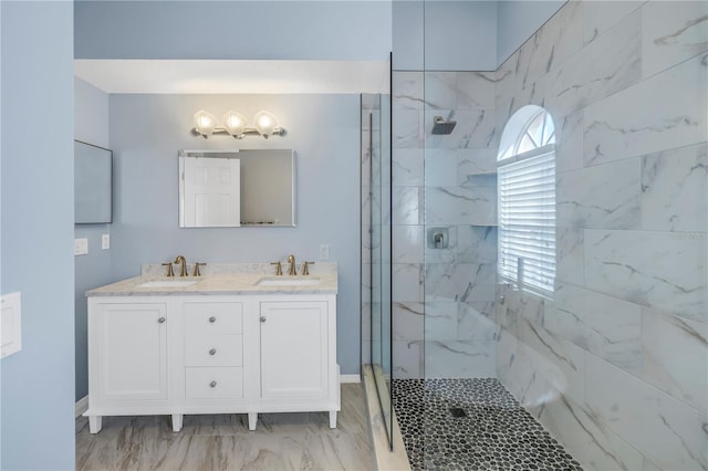 bathroom featuring vanity and a shower with shower door