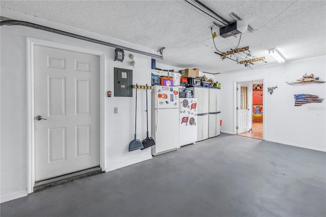 garage featuring electric panel, white fridge, and a garage door opener