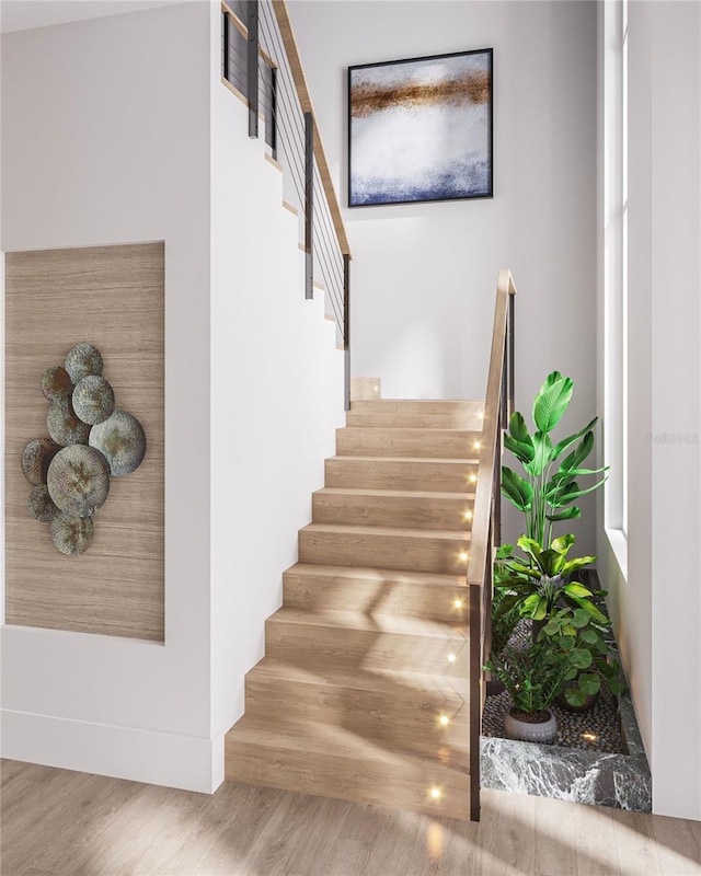 stairs with hardwood / wood-style floors