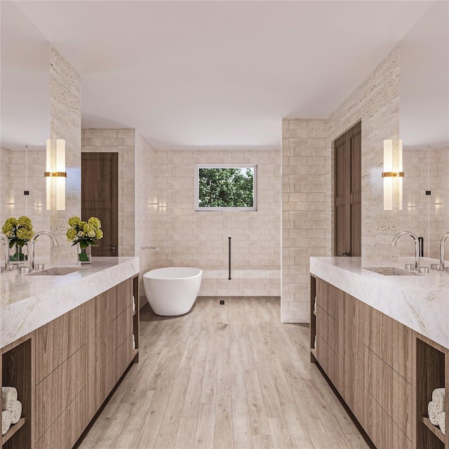 bathroom featuring vanity, wood-type flooring, and tile walls