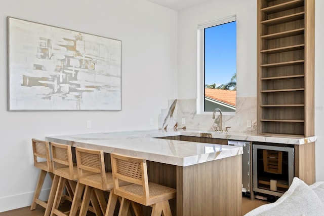 bar featuring dark hardwood / wood-style floors, sink, wine cooler, and decorative backsplash