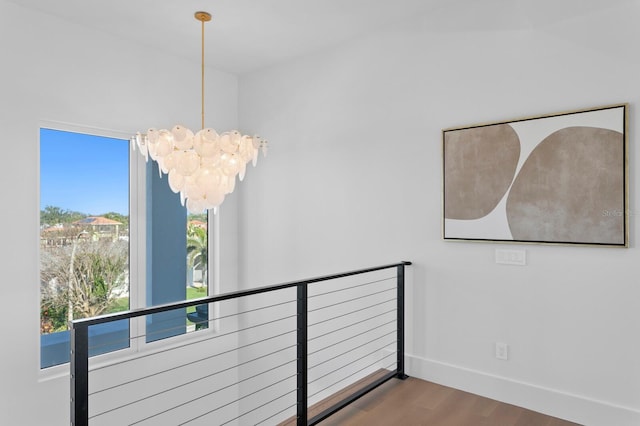 interior space with hardwood / wood-style flooring and a chandelier