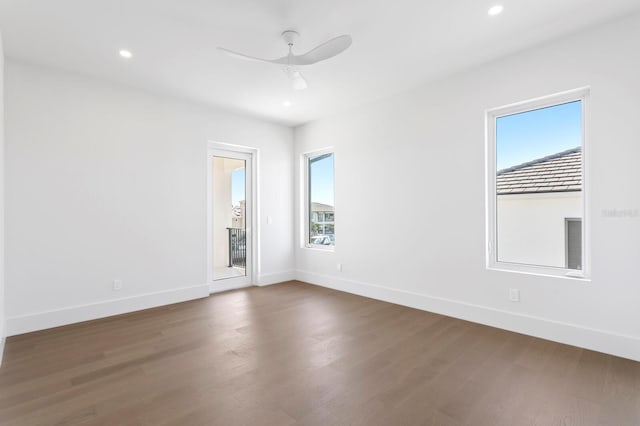 spare room with ceiling fan and hardwood / wood-style floors