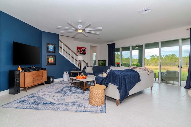 tiled living room with ceiling fan