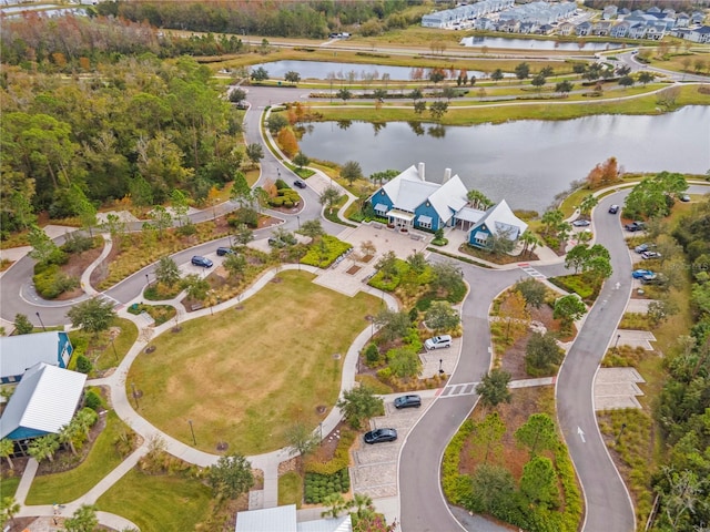 birds eye view of property with a water view