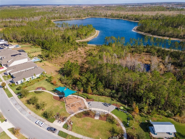 aerial view featuring a view of trees and a water view