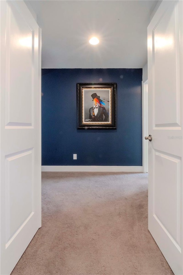 hallway with light colored carpet