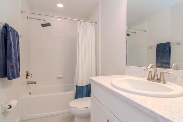 full bathroom with vanity, toilet, tile patterned flooring, and shower / bath combo