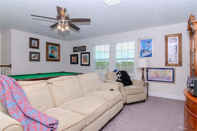 living room featuring visible vents, carpet floors, baseboards, and ceiling fan